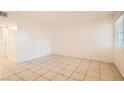 Bright living room featuring tiled floor and natural light from window at 212 Orland St # 19, Las Vegas, NV 89107