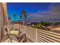 Balcony with seating offers views of palm trees and residential neighborhood at 2248 Verde Cape Ave, Henderson, NV 89052