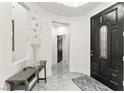 Inviting front entryway features tile floors, decorative details, and a black front door at 366 Rancho La Costa St, Las Vegas, NV 89138