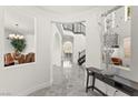 Spacious entryway with marble floors, arched doorways, and a view of the staircase at 366 Rancho La Costa St, Las Vegas, NV 89138