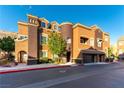 Stunning townhome with a turret, desert landscaping, and attached two-car garage at 3975 N Hualapai Way # 212, Las Vegas, NV 89129