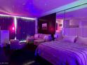 This modern bedroom is decorated with star lights, a large mirror and a comfortable sitting area at 4381 W Flamingo Rd # 1504, Las Vegas, NV 89103