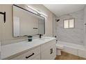 Modern bathroom featuring marble tile, updated fixtures, and a clean aesthetic at 4804 Apawana Ln, Las Vegas, NV 89108