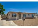 Attractive one-story house with xeriscape landscaping and covered entrance, enhanced curb appeal at 4804 Apawana Ln, Las Vegas, NV 89108