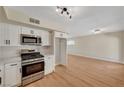 Well-lit kitchen with stainless steel appliances and ample counter space at 4804 Apawana Ln, Las Vegas, NV 89108