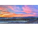 Panoramic city skyline view from the surrounding hills at sunset at 5252 Sunstone Mesa Dr, Las Vegas, NV 89166
