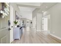Bright entryway with light wood floors, open floorplan, and contemporary decor at 5600 Blue Peak Ave, Las Vegas, NV 89131