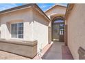 Inviting front entrance featuring a decorative wreath on the front door, framed by sidelights at 5600 Blue Peak Ave, Las Vegas, NV 89131