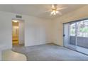 Cozy bedroom with sliding glass doors and access to outdoor balcony, perfect for relaxation at 5751 E Hacienda Ave # 105, Las Vegas, NV 89122