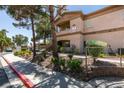 Beautiful desert landscape and mature trees surrounding condominium at 5751 E Hacienda Ave # 105, Las Vegas, NV 89122