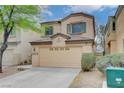 Inviting two-story home with a two-car garage and desert landscaping in a quiet neighborhood at 6549 Butterfly Sky St, North Las Vegas, NV 89084