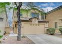 Attractive two-story house featuring a two-car garage and easy to maintain landscaping at 6549 Butterfly Sky St, North Las Vegas, NV 89084