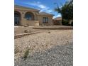 Attractive home with arched entry and desert-style rock landscaping, offering a low-maintenance and visually appealing outdoor space at 6841 Longmeadow Dr, Pahrump, NV 89061