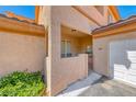Inviting entrance featuring decorative stonework, desert landscaping, and a private entry gate at 6916 Dorita Ave # 102, Las Vegas, NV 89108