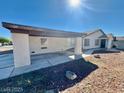 Single-story home featuring a covered parking area and low maintenance landscaping at 6955 Grassy Knoll St, Las Vegas, NV 89147