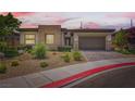 Charming single-story home featuring a stone facade and a two-car garage at 7473 Deschutes Cir, Las Vegas, NV 89129
