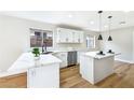 Well-lit kitchen with an island, stainless steel appliances, and white cabinetry at 8113 Bay Springs Dr, Las Vegas, NV 89128