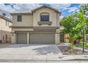Charming two-story home features a well-maintained lawn and attached two car garage at 8217 Fritzen Ave, Las Vegas, NV 89131