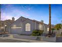 Attractive single-Gathering home featuring a two-car garage at 8228 Lauderdale Ct, Las Vegas, NV 89128