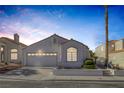 Charming single-story home with a well-maintained lawn at 8228 Lauderdale Ct, Las Vegas, NV 89128