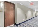 Hallway view of an apartment building, including the apartment's door at 8255 Las Vegas Blvd # 1422, Las Vegas, NV 89123