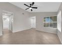 Spacious living room with tile floors and many windows at 908 Coral Isle Way, Las Vegas, NV 89108