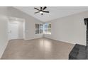 Living room with tile flooring, ceiling fan and ample natural light at 908 Coral Isle Way, Las Vegas, NV 89108