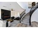 Living room features a fireplace and staircase with an open landing at 9541 Summersweet Ct, Las Vegas, NV 89123