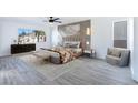 Tranquil main bedroom with large window and stylish décor at 9541 Summersweet Ct, Las Vegas, NV 89123