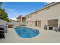 Private backyard featuring a refreshing pool, a relaxing spa, and a convenient barbecue area at 9815 Ramhorn Canyon St, Las Vegas, NV 89183