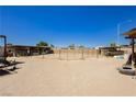 This horse property features an outdoor riding area with shelters, offering a perfect setting for horse lovers at 997 N Christy Ln, Las Vegas, NV 89110