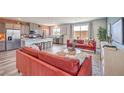 Bright living space with open floor plan seamlessly connecting the kitchen, dining, and living areas at 1019 Gentle Swan St # 693, Henderson, NV 89011