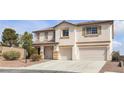 Inviting two-story home with a spacious driveway and a two-car garage at 10508 Waking Cloud Ave, Las Vegas, NV 89129