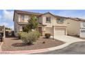 Attractive two-story home featuring a tile roof and well-maintained landscaping at 10508 Waking Cloud Ave, Las Vegas, NV 89129
