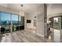Spacious living area with modern lighting, neutral paint, and stunning views of the Las Vegas skyline at 150 Las Vegas Blvd # 1507, Las Vegas, NV 89101