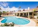 Inviting backyard pool and covered patio, ideal for outdoor relaxation at 1528 Tonada Way, Las Vegas, NV 89117