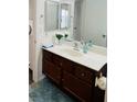 Bathroom with modern vanity, mirror, and fixtures at 1676 Divinity St, Las Vegas, NV 89142