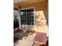 Charming front porch area with a covered entrance, offering a shaded and private entry at 1676 Divinity St, Las Vegas, NV 89142