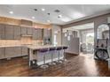 This kitchen features a center island with bar seating, stainless appliances, and ample cabinet space at 19 Contrada Fiore Dr, Henderson, NV 89011