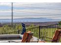 This backyard view features a beautiful desert landscape and the city skyline beyond at 19 Contrada Fiore Dr, Henderson, NV 89011