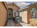 Cozy front patio with a table and chairs, great for outdoor relaxation and entertaining at 2631 Bed Knoll Ct, North Las Vegas, NV 89031