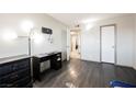 Spacious bedroom with hardwood floors and a walk-in closet at 4666 Plata Del Sol Dr, Las Vegas, NV 89121