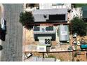 Aerial view of home with solar panels, covered entry, a carport, and a large workshop at 4682 Tamalpias Ave, Las Vegas, NV 89120