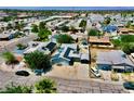 Aerial view of neighborhood with home, showing solar panels, workshop, and adjacent houses at 4682 Tamalpias Ave, Las Vegas, NV 89120