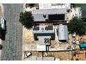 Aerial view of home showing the solar panels, covered entry, large workshop, and carport at 4682 Tamalpias Ave, Las Vegas, NV 89120