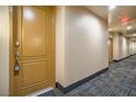 Condo hallway with carpet and secure door at 55 E Agate Ave # 202, Las Vegas, NV 89123