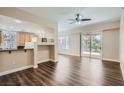 Spacious living room features wood floors and slider to patio at 55 E Agate Ave # 202, Las Vegas, NV 89123