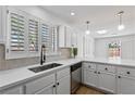Bright kitchen features white cabinets, stainless steel appliances, and natural light at 5516 Ness Ave, Las Vegas, NV 89118