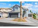 Charming two-story home featuring a gray garage door, a well-manicured lawn and blue sky background at 5950 Pacific Shores Dr, Las Vegas, NV 89142