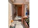 Inviting entryway with a decorative security door and views of a well-maintained yard, plus security system at 6429 Rosemount Ave, Las Vegas, NV 89156